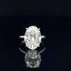 18K white gold solitaire ring with a 7.44 carat oval lab grown diamond
