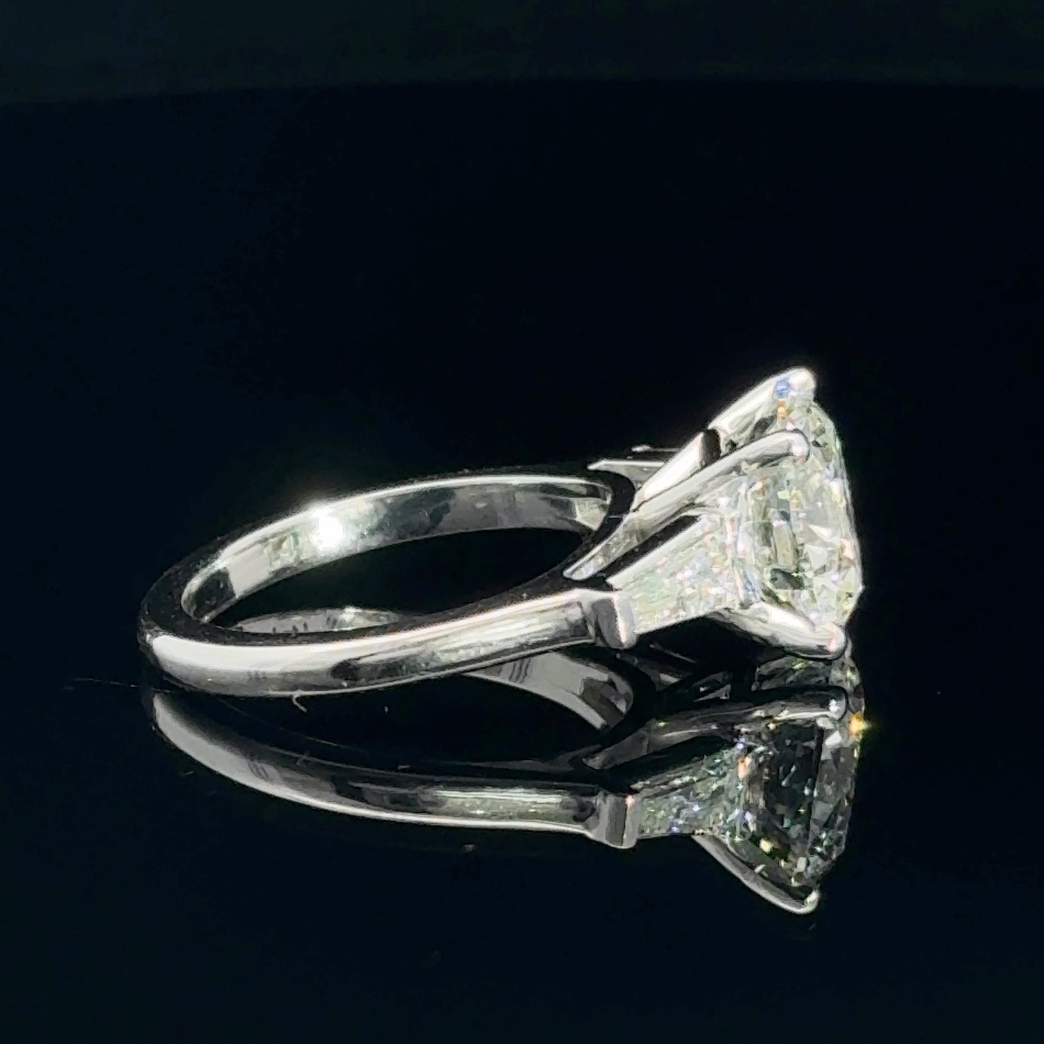 14K white gold engagement ring with a 3.75 carat round brilliant lab grown diamond and tapered baguette side stones