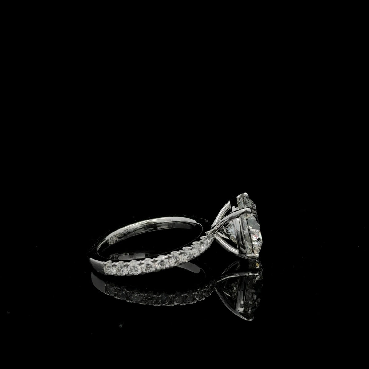 14K white gold engagement ring with a 4.10 carat round lab grown diamond, 5.01 carats total